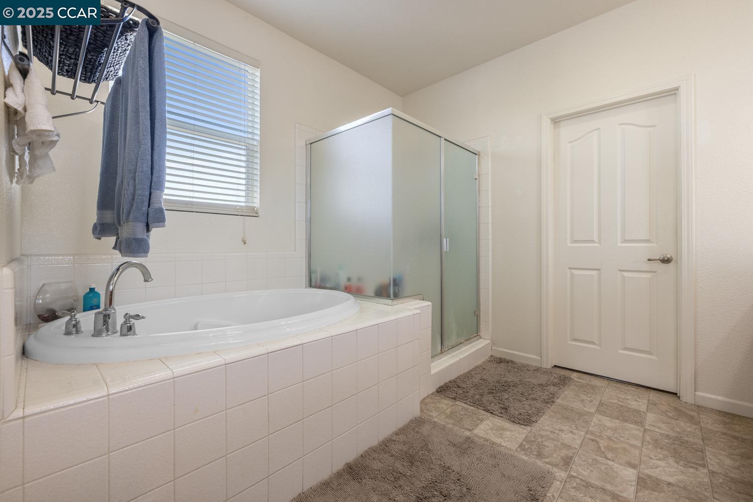 1117 Van Gogh Lane Patterson, CA 95363 - Photo 40 of 55 a bathroom with a sink and a mirror