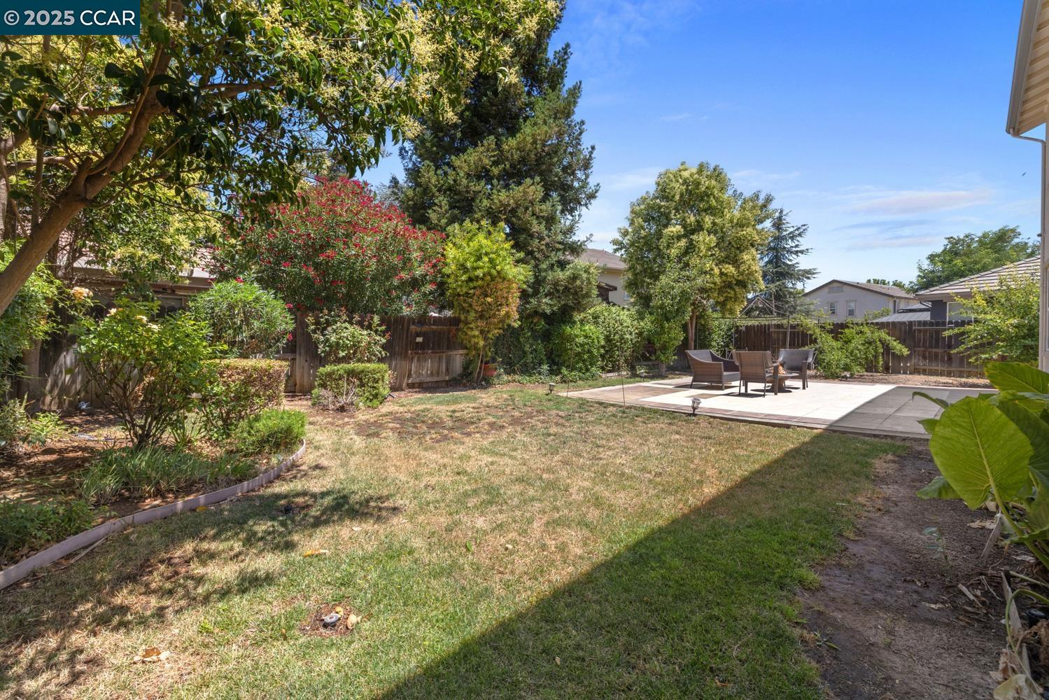 1117 Van Gogh Lane Patterson, CA 95363 - Photo 41 of 55 a view of outdoor space with trees all around