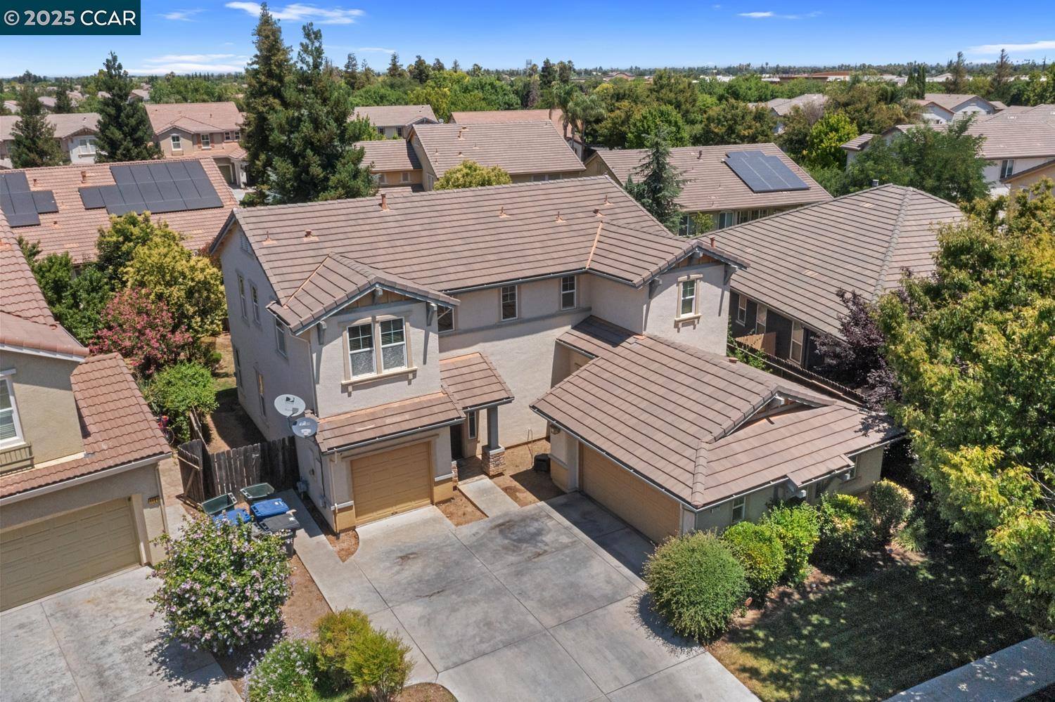 1117 Van Gogh Lane Patterson, CA 95363 - Photo 46 of 55 an aerial view of a house with a garden