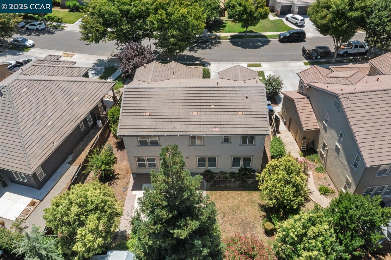 1117 Van Gogh Lane Patterson, CA 95363 - Photo 48 of 55 a view of a house with a yard and potted plants