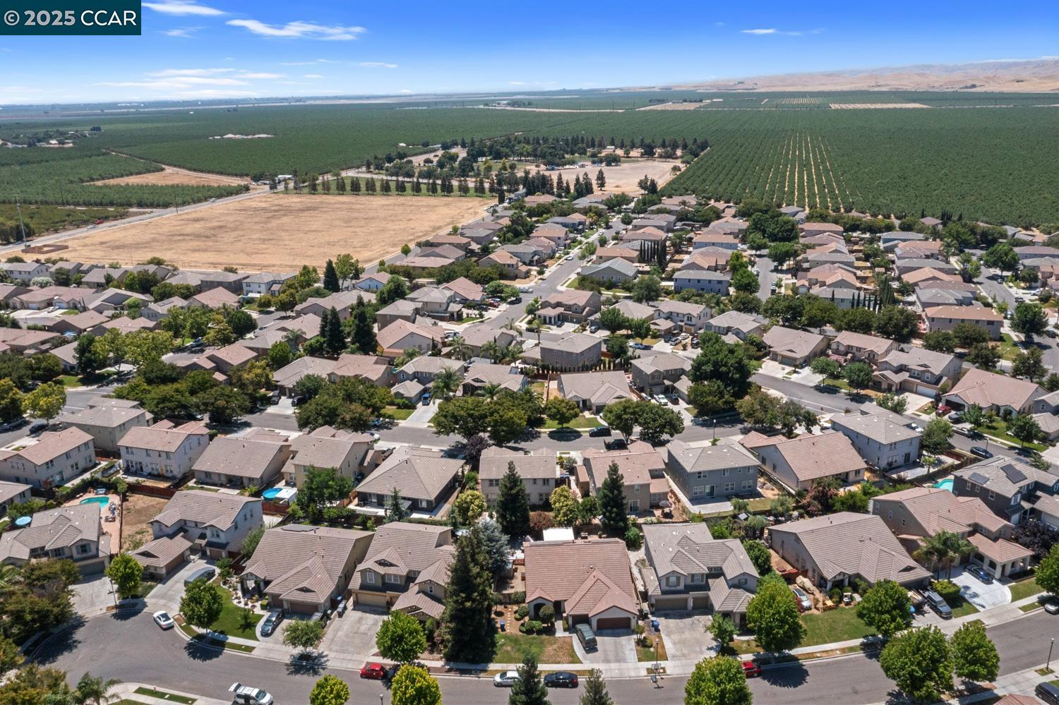 1117 Van Gogh Lane Patterson, CA 95363 - Photo 49 of 55 an aerial view of ocean and residential houses with outdoor space