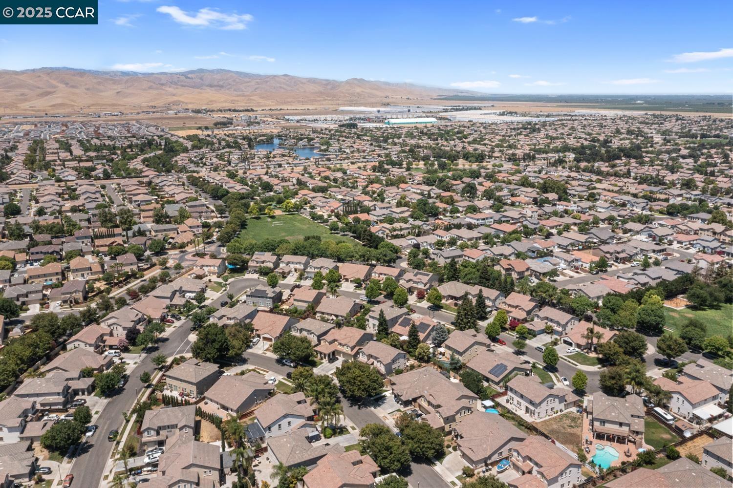 1117 Van Gogh Lane Patterson, CA 95363 - Photo 53 of 55 an aerial view of residential houses with city view