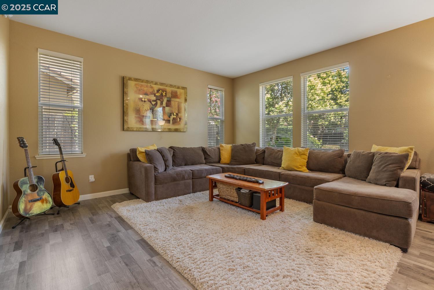 1117 Van Gogh Lane Patterson, CA 95363 - Photo 8 of 55 a living room with furniture and a window