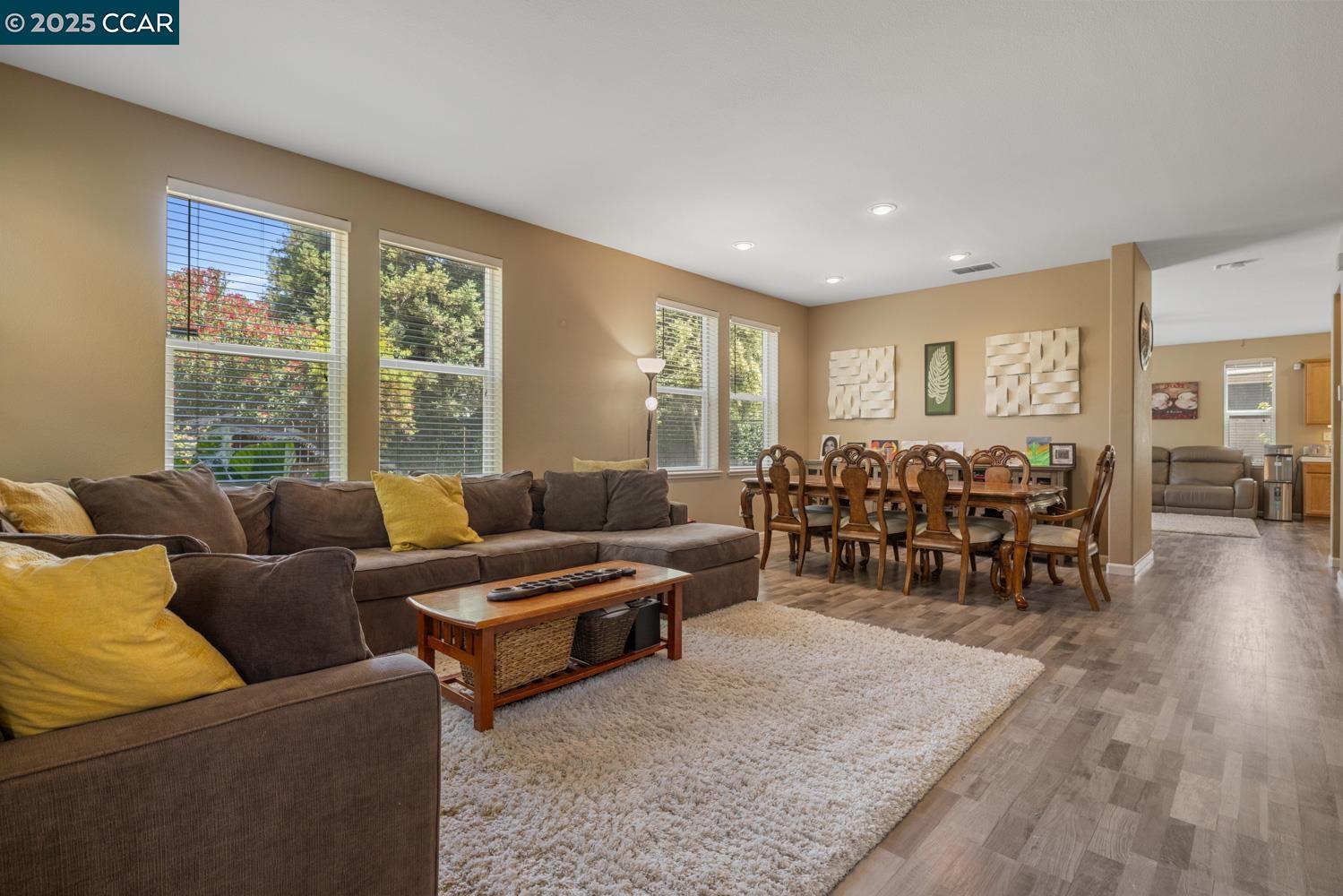 1117 Van Gogh Lane Patterson, CA 95363 - Photo 9 of 55 a living room with furniture and wooden floor