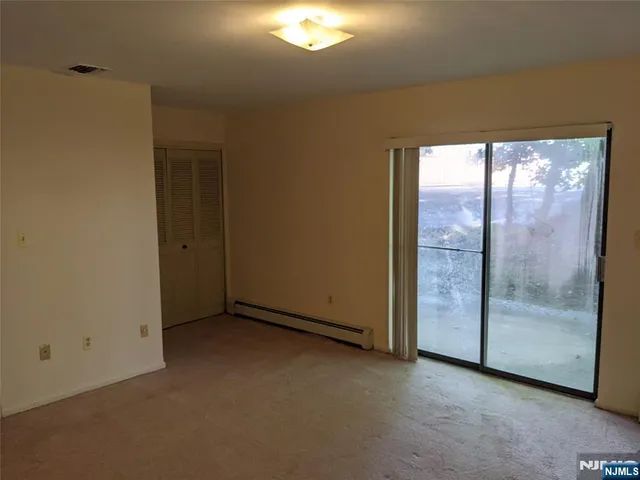 an empty room with sliding door