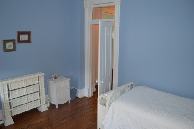 107 Lawton Road Riverside, IL 60546 - Photo 15 of 17 a bedroom with a bed and wooden floor