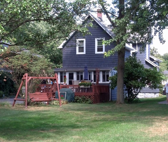107 Lawton Road Riverside, IL 60546 - Photo 16 of 17 a view of a house with a backyard