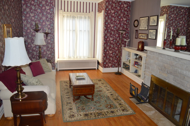 107 Lawton Road Riverside, IL 60546 - Photo 4 of 17 a living room with furniture and a fireplace