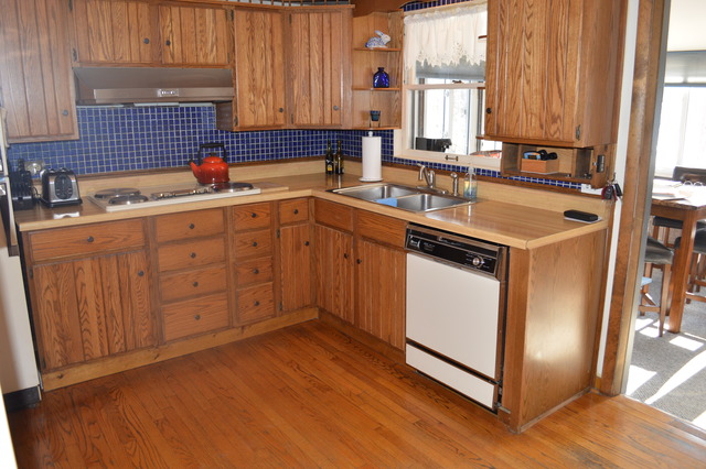 107 Lawton Road Riverside, IL 60546 - Photo 6 of 17 a kitchen with sink cabinets and window