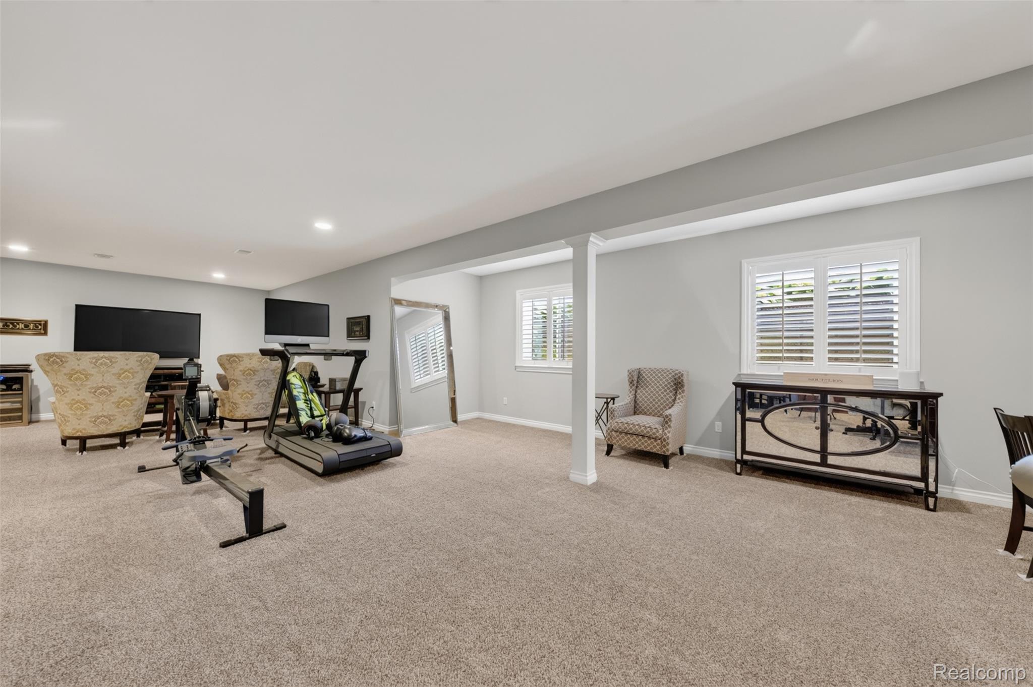 2531 Walnut View Drive Howell, MI 48855 - Photo 27 of 34 Spacious room featuring neutral carpeting, recessed lighting, and light gray wall paint