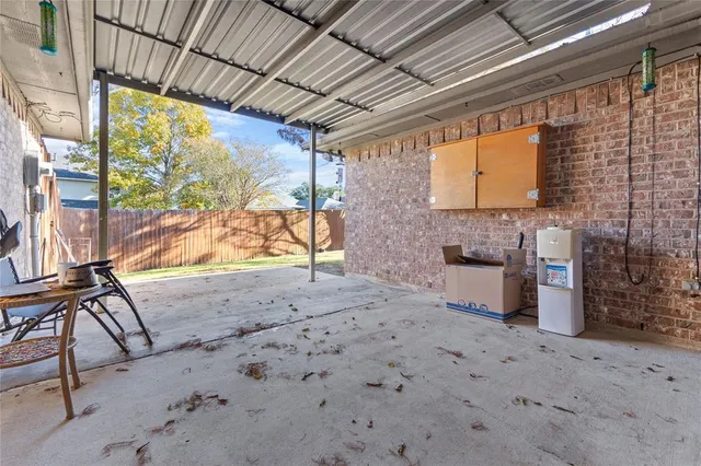 a view of a backyard with furniture and wooden roof