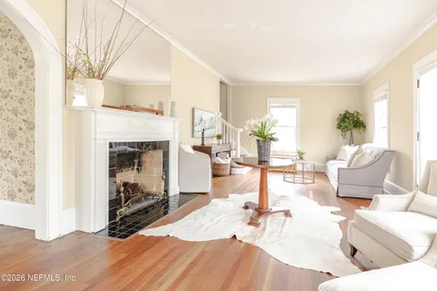 a living room with furniture and a window