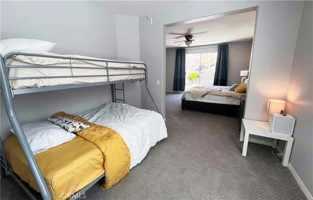 a bedroom with a bed and a lamp