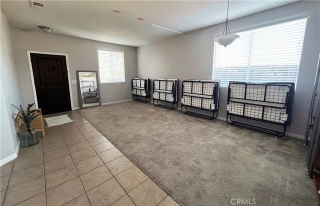 a view of an empty room with windows