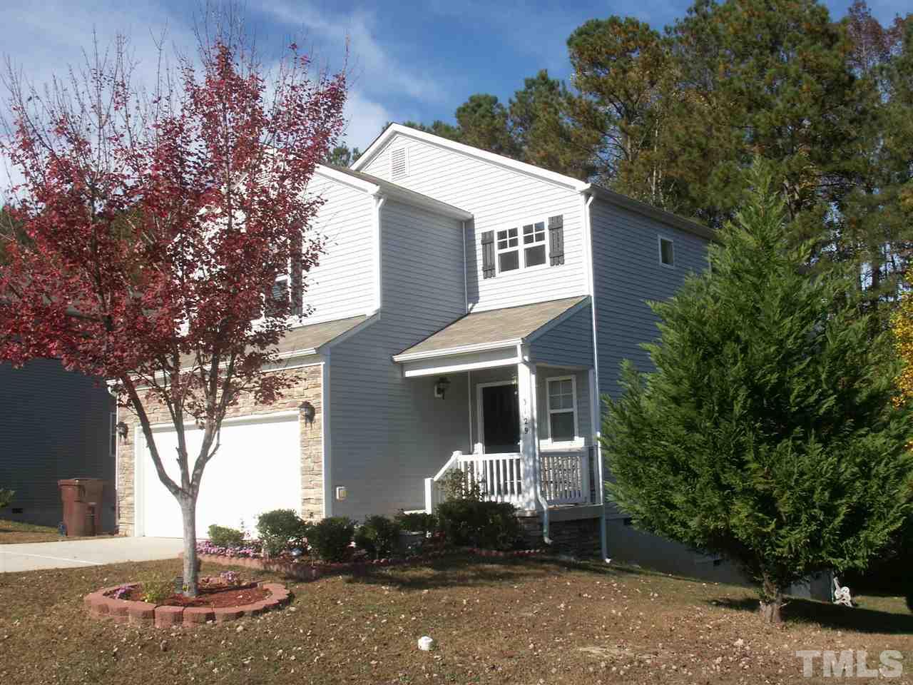 3129 Varcroft Road Knightdale, NC 27545 - Photo 1 of 25 a front view of a house with a yard and garage