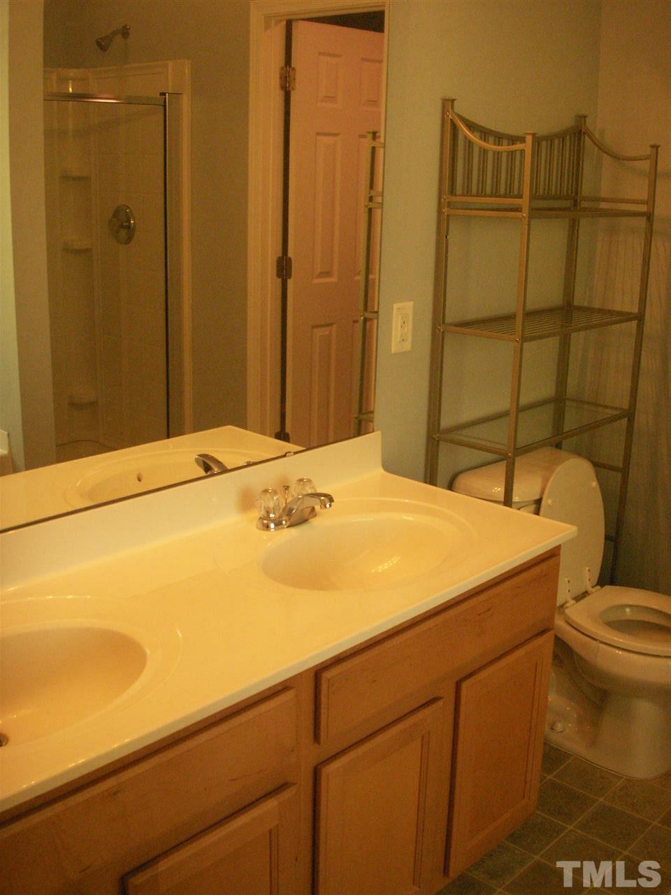 3129 Varcroft Road Knightdale, NC 27545 - Photo 16 of 25 a bathroom with a sink and toilet
