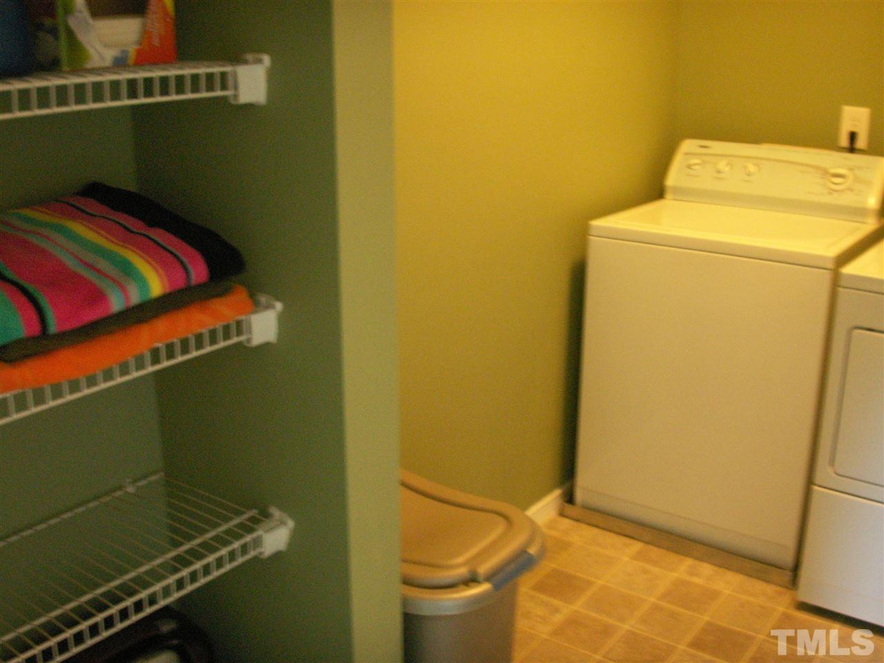 3129 Varcroft Road Knightdale, NC 27545 - Photo 19 of 25 a bathroom with a sink and a washer dryer