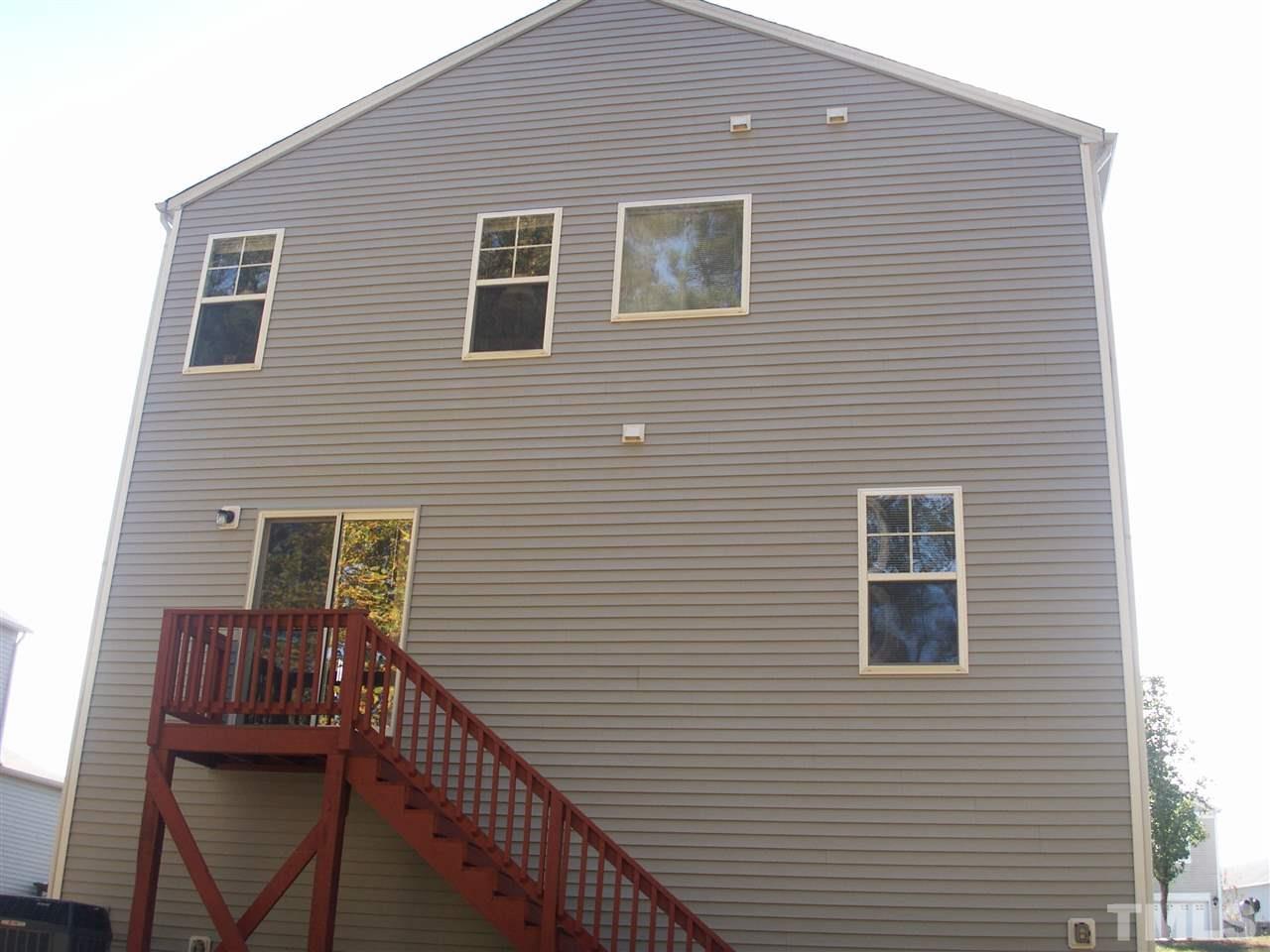 3129 Varcroft Road Knightdale, NC 27545 - Photo 3 of 25 a view of a house with wooden deck