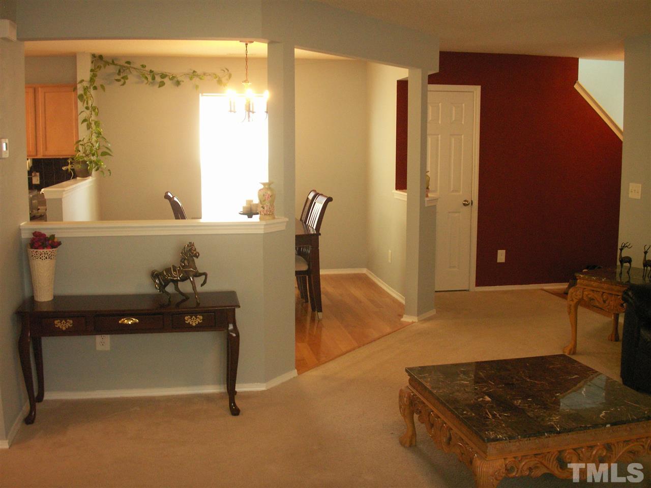 3129 Varcroft Road Knightdale, NC 27545 - Photo 6 of 25 a living room with a table and a window