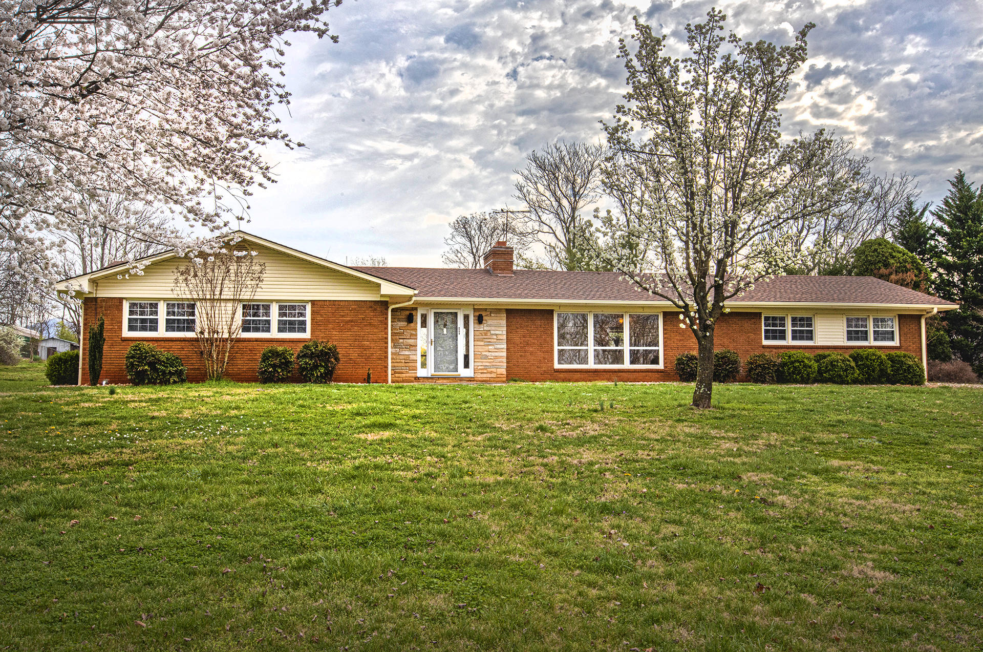 1087 Ross Road Vinton, VA 24179 - Photo 1 of 24 a front of a house with a garden