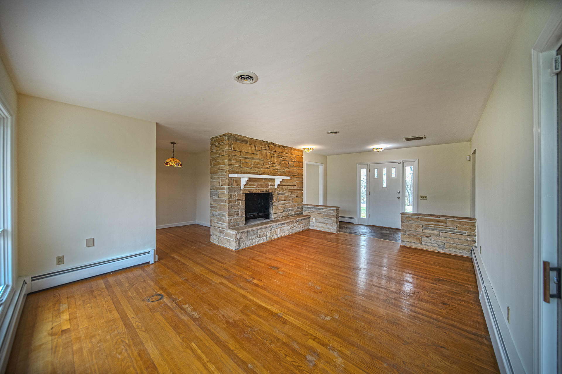 1087 Ross Road Vinton, VA 24179 - Photo 11 of 24 a view of empty room with wooden floor and fireplace