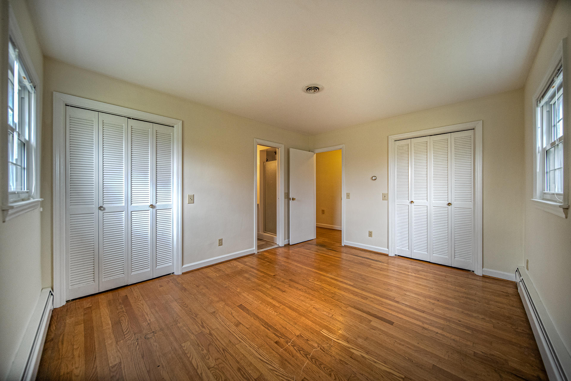 1087 Ross Road Vinton, VA 24179 - Photo 13 of 24 a view of an empty room with wooden floor and a window