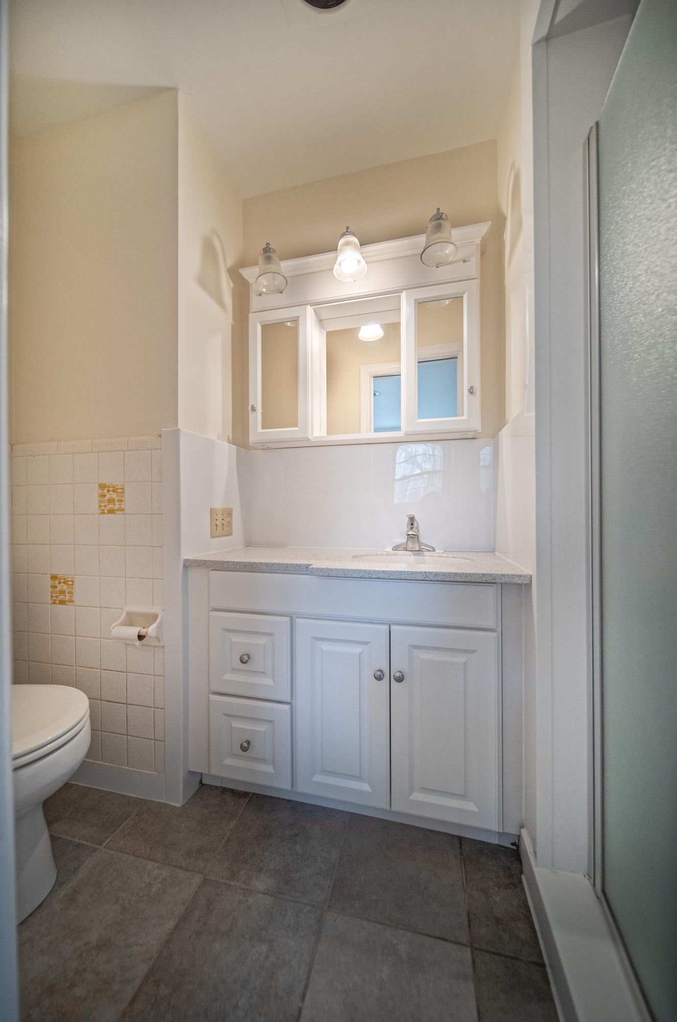 1087 Ross Road Vinton, VA 24179 - Photo 14 of 24 a bathroom with a toilet sink and mirror
