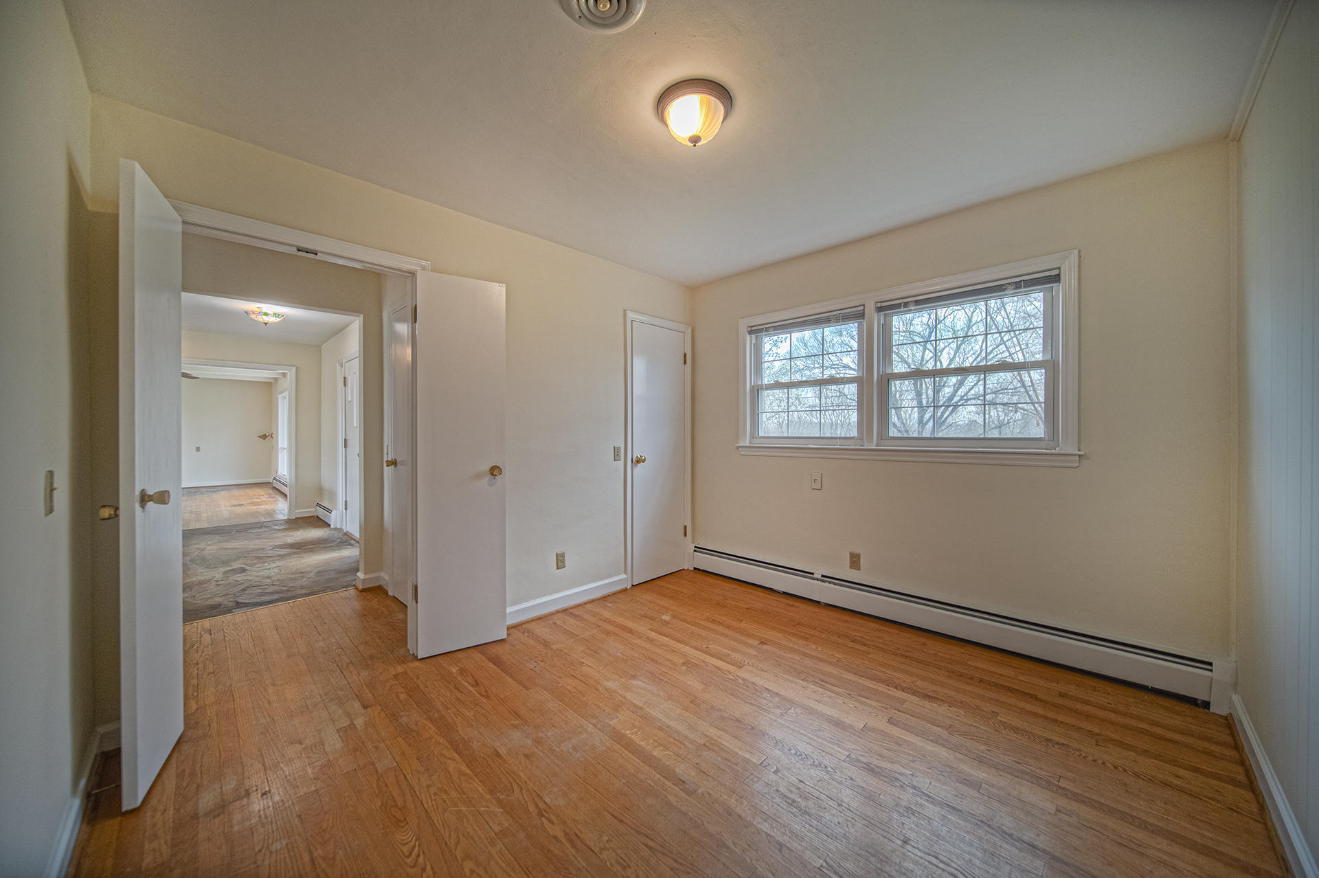 1087 Ross Road Vinton, VA 24179 - Photo 17 of 24 wooden floor in an empty room with a window