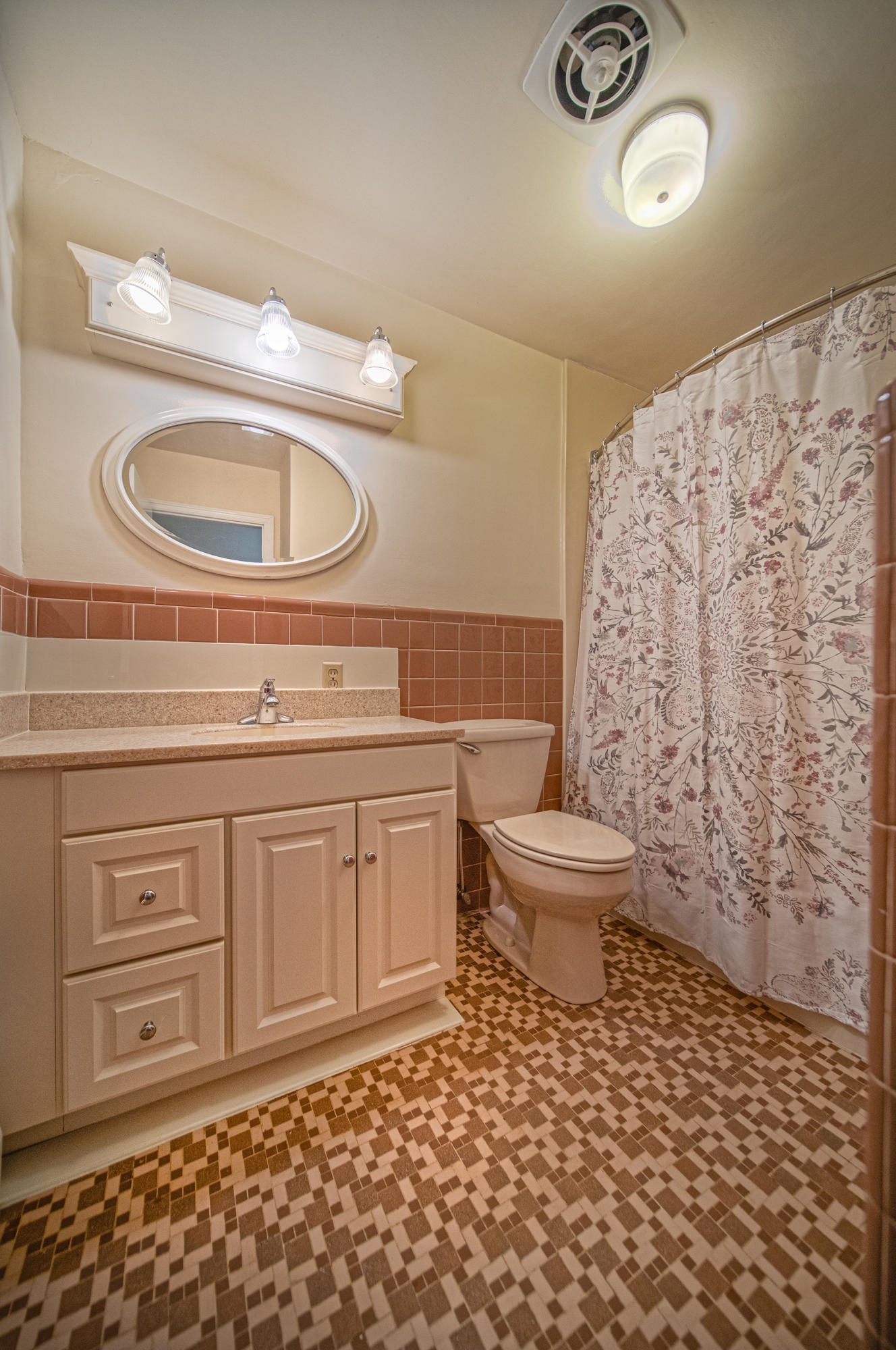 1087 Ross Road Vinton, VA 24179 - Photo 18 of 24 a bathroom with a toilet a sink and a mirror