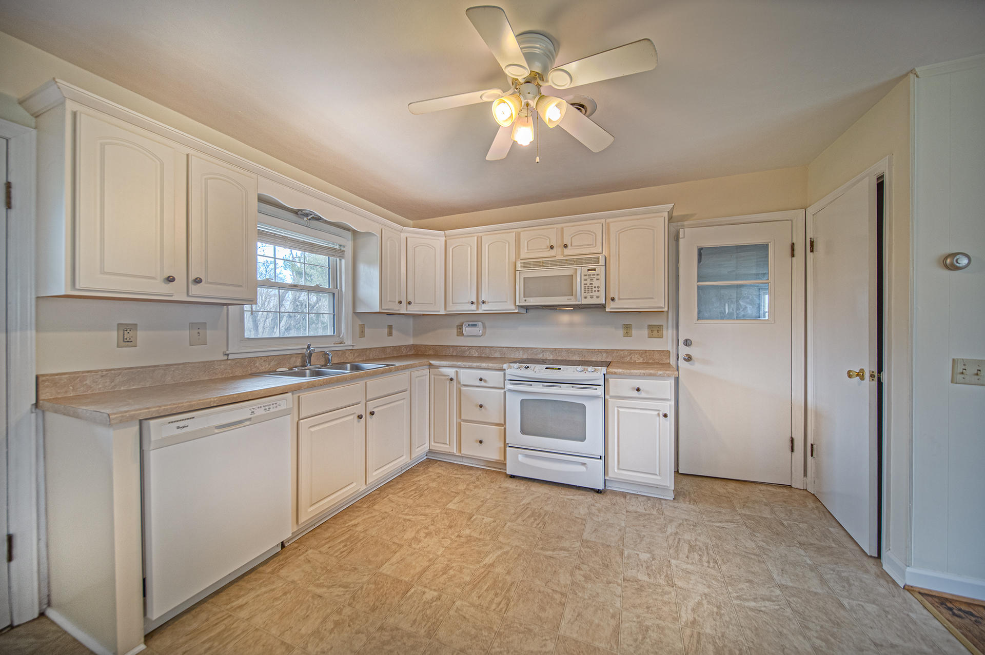 1087 Ross Road Vinton, VA 24179 - Photo 3 of 24 a kitchen with a stove a sink and dishwasher refrigerator
