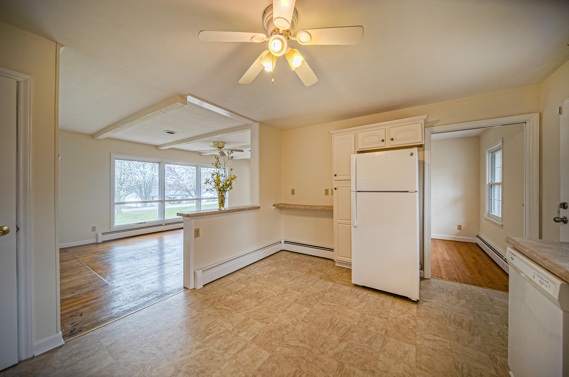 1087 Ross Road Vinton, VA 24179 - Photo 6 of 24 an empty room with chandelier fan and windows