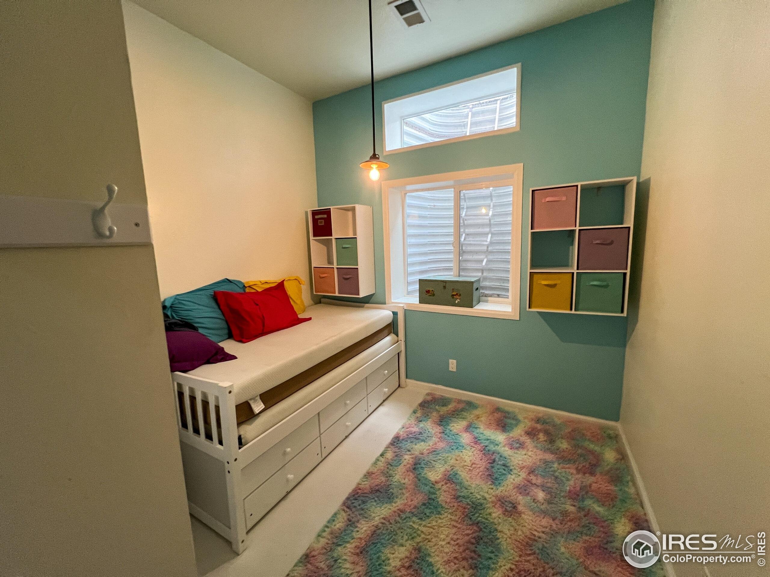 27667 Buckhorn Road Bellvue, CO 80512 - Photo 19 of 40 a living room with furniture and a window