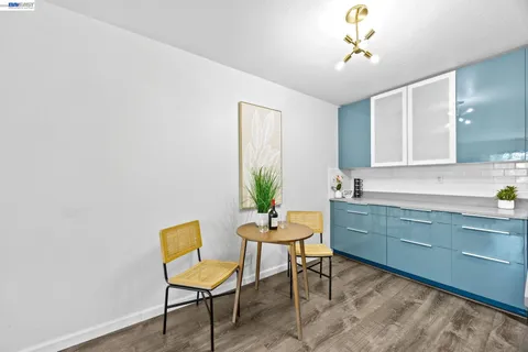 a view of a room with a table and chairs