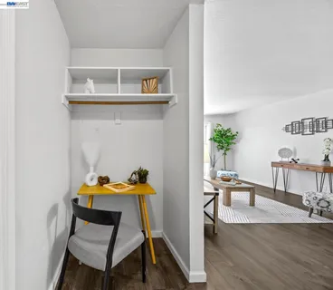 a dining room with furniture and wooden floor