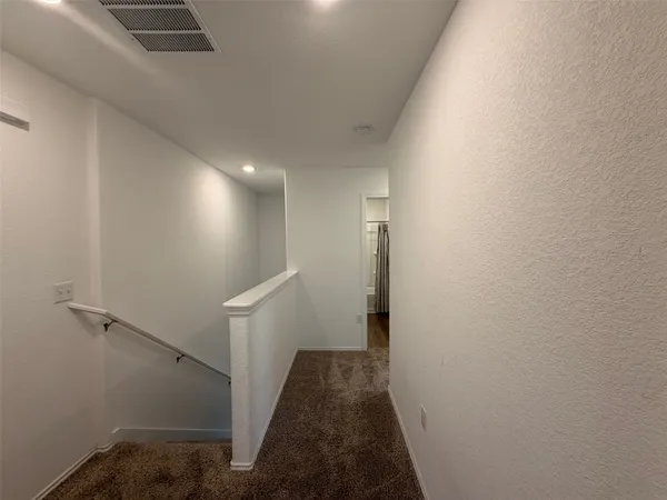 a view of hallway with stairs