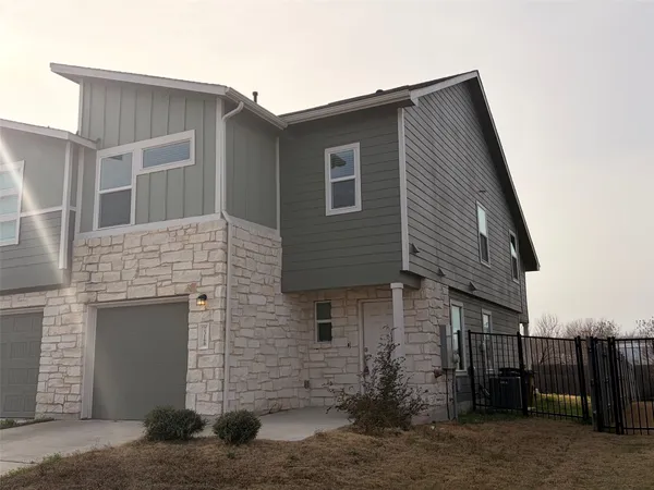 a front view of a house with a garage