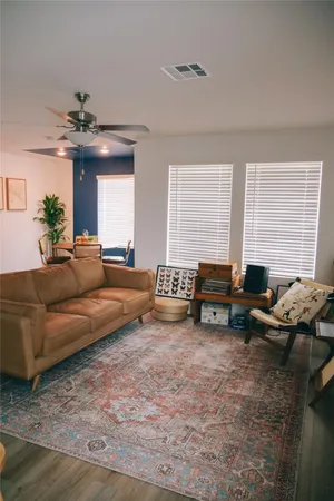 a living room with furniture and a fireplace