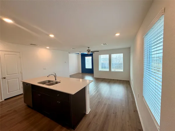 a kitchen with a sink and dish washer
