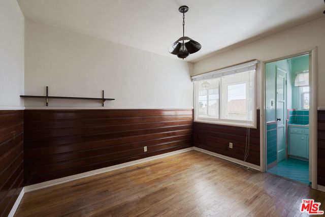 a spacious bathroom with a bathtub and a sink