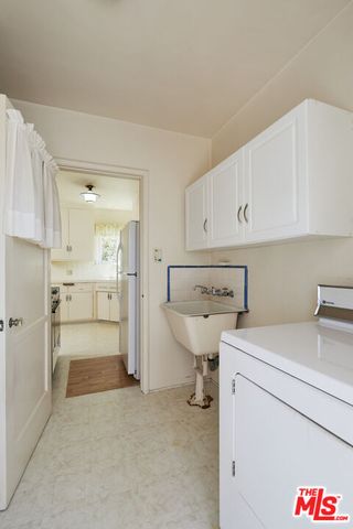a view of a kitchen with a stove top oven