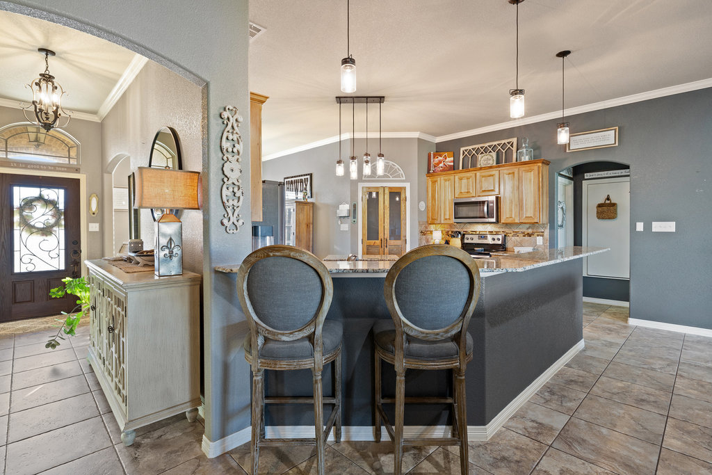 153 Ranger Boulevard Salado, TX 76571 - Photo 14 of 40 a very nice looking dining room with wooden floor and furniture