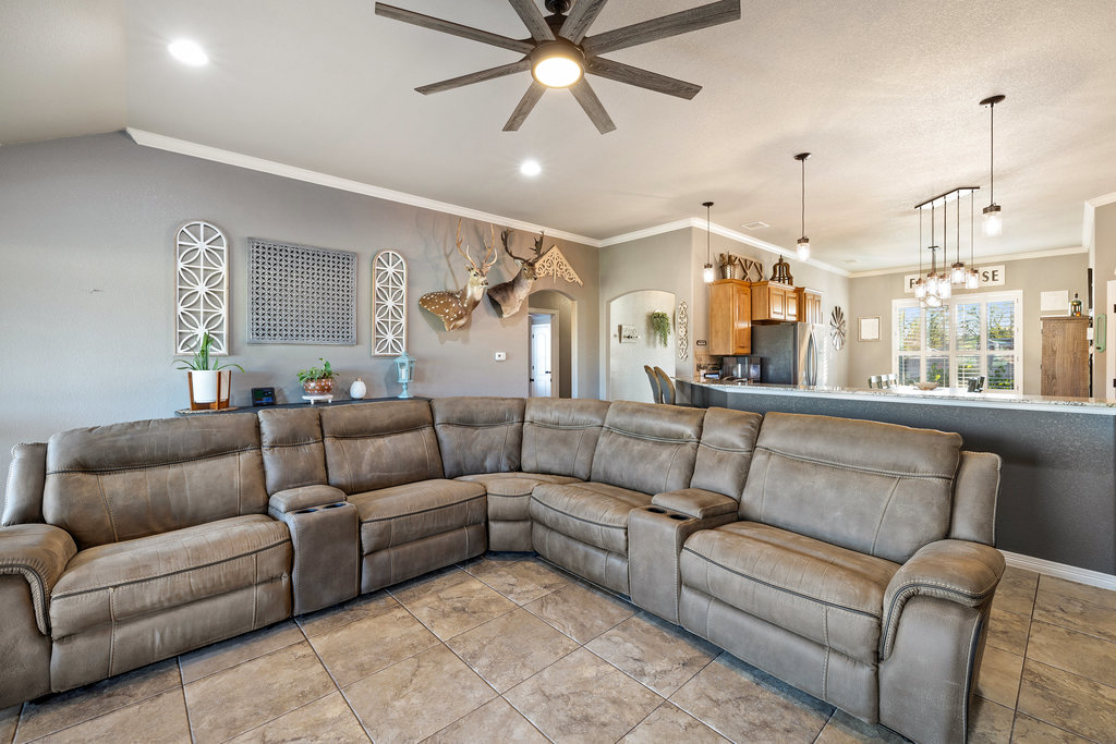 153 Ranger Boulevard Salado, TX 76571 - Photo 16 of 40 a living room with furniture ceiling fan and a window