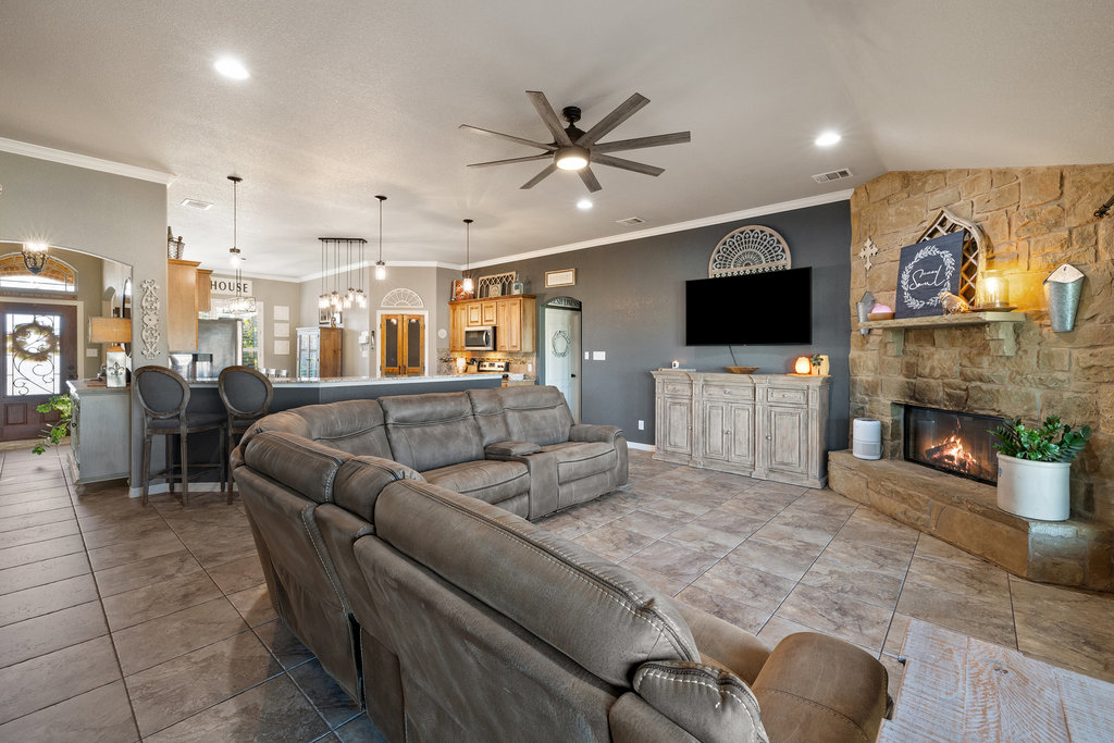 153 Ranger Boulevard Salado, TX 76571 - Photo 18 of 40 a living room with fireplace furniture and a flat screen tv