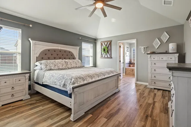 a bedroom with a bed and a dresser