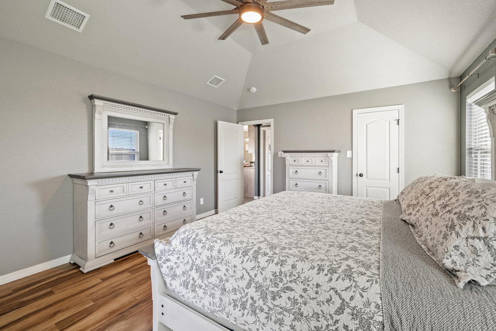 153 Ranger Boulevard Salado, TX 76571 - Photo 20 of 40 a bedroom with a bed and a dresser
