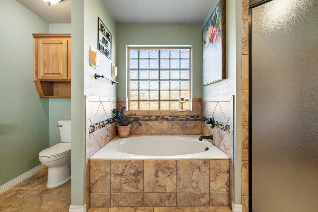 153 Ranger Boulevard Salado, TX 76571 - Photo 21 of 40 a spacious bathroom with sink toilet and shower