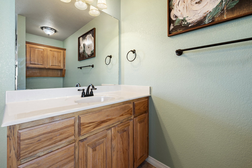 153 Ranger Boulevard Salado, TX 76571 - Photo 26 of 40 a bathroom with a sink vanity and a mirror