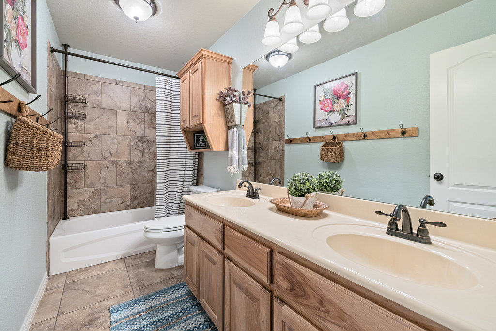 153 Ranger Boulevard Salado, TX 76571 - Photo 29 of 40 a bathroom with a sink a toilet and shower