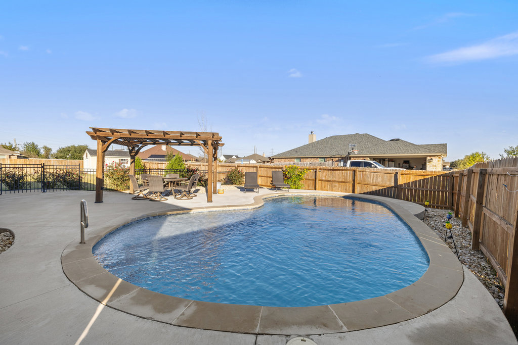 153 Ranger Boulevard Salado, TX 76571 - Photo 36 of 40 a view of a swimming pool with a lounge chair
