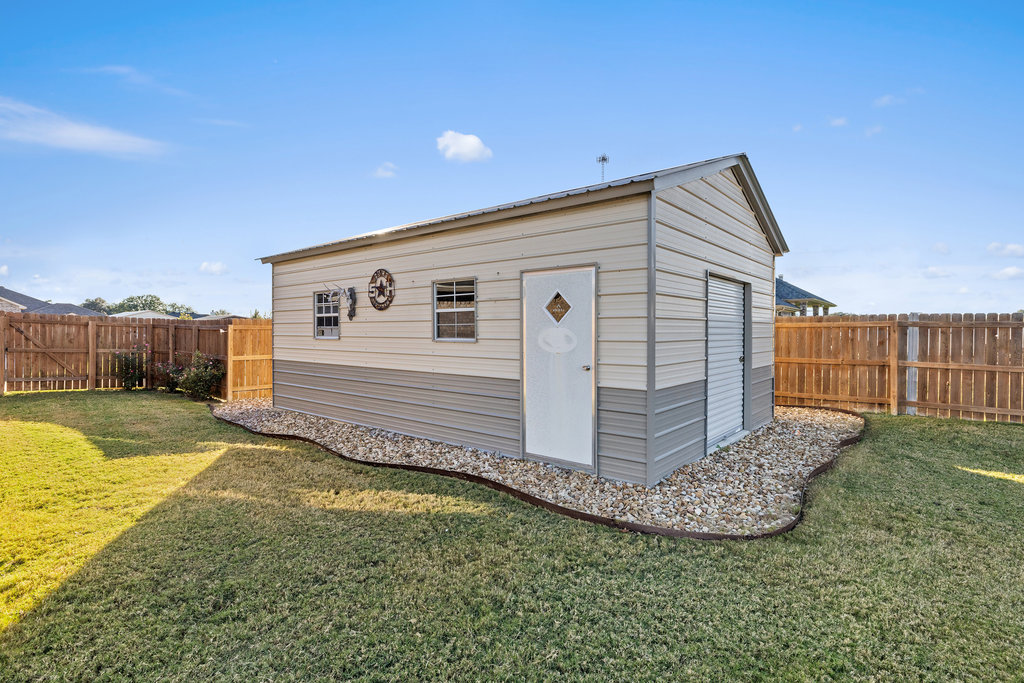 153 Ranger Boulevard Salado, TX 76571 - Photo 39 of 40 a view of a backyard with wooden fence